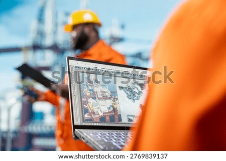 Close up of geophysicist analyzing map on device screen to determine best offshore drilling location. Specialist looking at global exploration data on notebook, selecting new well installation sites