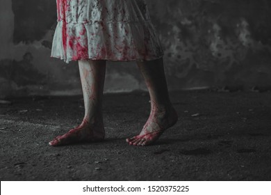 Close up ghost woman leg with blood. Zombie girl walking with blood. Horror and scary concept. Thriller concept.