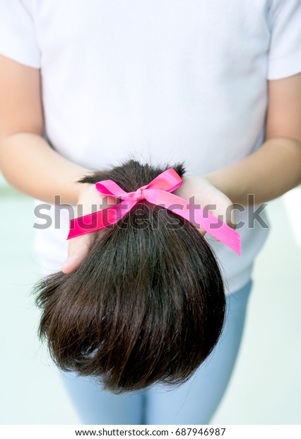 giving hair to cancer