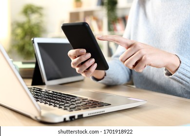 Close Up Of Girl Hands Using Multiple Devices On A Desk At Home