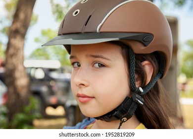 Close Up Of A Girl Waiting For A Horse Riding Lesson