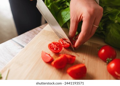 A close up of girl's or woman's hands peeling and cutting vegetables with knife making salad	
 - Powered by Shutterstock