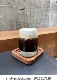 Close Up Glass Of Iced Cold Brew Coffee Topped With Cream Cheese