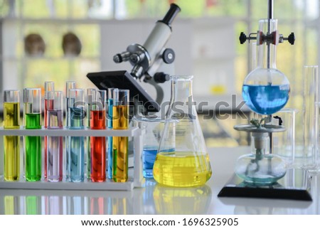 Close up of glass laboratory chemical with chemical compounds inside in the lap