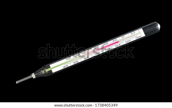 Mercury thermometer showing feverish temperature in stock photo