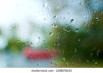 Close Up Of A Glass Surface Covered In Waterdrops.