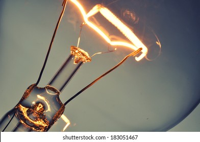 Close up glowing light bulb - Powered by Shutterstock