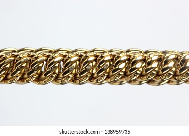 Close Up Of Gold Chain On The White Background