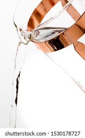 Close Up Of Gold Fancy French Press Coffee Carafe Pouring Water On A White Background. 