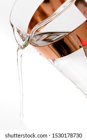 Close Up Of Gold Fancy French Press Coffee Carafe Pouring Water On A White Background. 