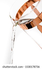 Close Up Of Gold Fancy French Press Coffee Carafe Pouring Water On A White Background. 