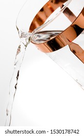 Close Up Of Gold Fancy French Press Coffee Carafe Pouring Water On A White Background. 