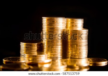 Close up gold money coin stacking on dark background