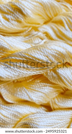 Similar – Image, Stock Photo Close-up of golden yarn bundles in textile production