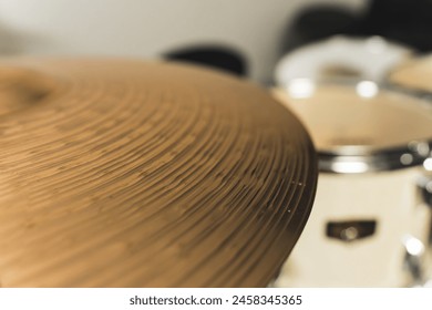 Close up of golden bronze cymbal plate part of drum. High quality photo