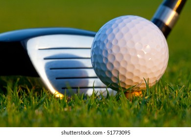 Close Up Of Golf Ball And Driver Head