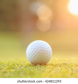 Close Up Golf Ball On Green Grass In Course