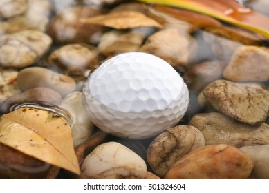 Close Up Golf Ball In Water Hazard