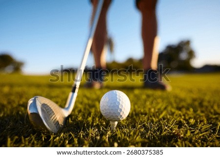 Close up of golfer preparing for the first hit on the course.