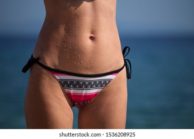 Close Up Goosebumps And Drops Of Water Woman Body At The Beach, Cold Shiver And Chills. Woman Navel 