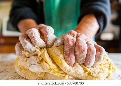 close up of grandma making pasta the traditional way