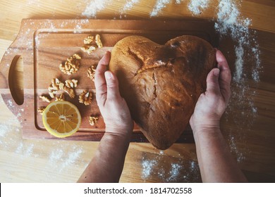 Close Up Of Grandma's Hands Cooking Homemade Cake In The Kitchen Top View