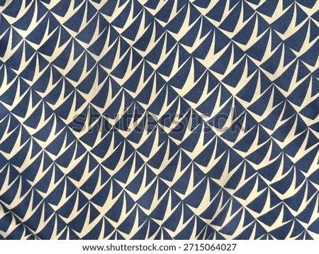 Close up of graphic background random abstract geometrical pattern in dark blue and whitecolor. Suitable for wallpaper or fabric upholstery. Seamless background texture.