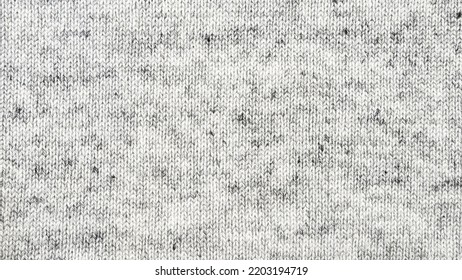 Close up gray cotton heather texture background.  
Black and white texture knit fabric pattern seamless.
Selective focus.
top view. - Shutterstock ID 2203194719
