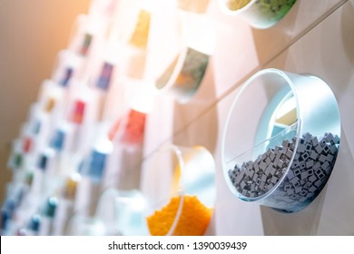 Close Up Of Gray (grey) Plastic Toy Bricks Inside Self Service Container Shelf Display In Kids Toy Store.