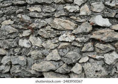 A close up gray pebbles, scattered to form a unique background - Powered by Shutterstock