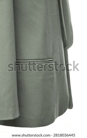 Close up of gray wool coat featuring a welt pocket and smooth premium fabric texture. Elegant outerwear detail suitable for business, office, casual and smart casual styling, ideal for fashion catalogs, online stores and e-commerce listings.