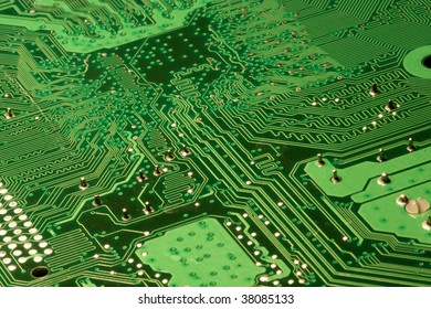 Close up of a Green computer circuit board.
