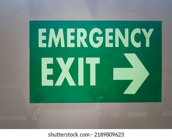 Close Up Of Green Emergency Exit Sign In Hospital Building