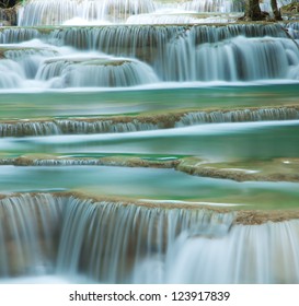 Close up green forest waterfall Huay Mae Kamin National Park Kanjanaburi Thailand - Powered by Shutterstock