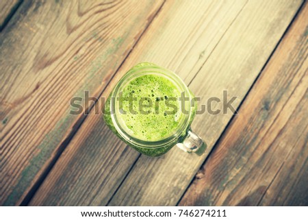 Similar – Foto Bild Grünkohl Smoothie im Glas auf weißem Holzgrund.