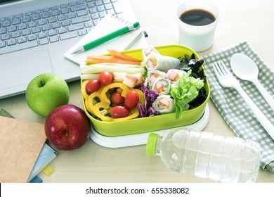 Close Up Green Lunch Box On Work Place Of Working Desk ,Healthy Eating Clean Food Habits For Diet And Health Care Concept