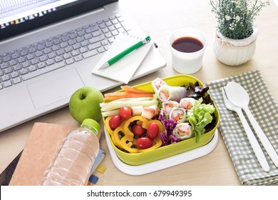 Close Up Green Lunch Box On Work Place Of Working Desk ,Healthy Eating Clean Food Habits For Diet And Health Care Concept