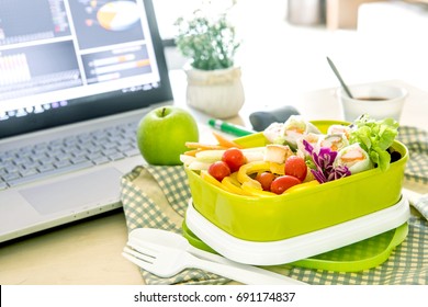 Close Up Green Lunch Box On Work Place Of Working Desk ,Healthy Eating Clean Food Habits For Diet And Health Care Concept