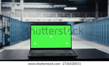 Close up of green screen laptop in data center used for checking hardware for system stability. Mockup notebook used to oversee server farm and configure infrastructure for optimum performance