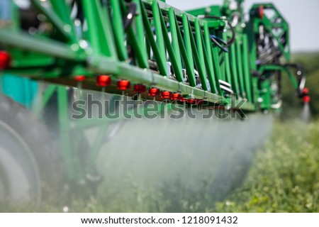 close up green sprayer to protect plants while working in the field
