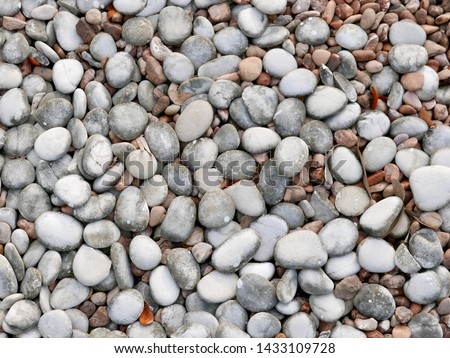 Close up of grey and brown pebbles as background