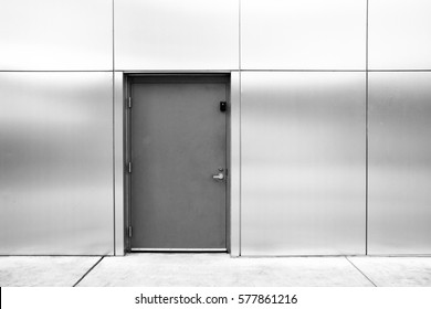 Close Grey Door With Aluminium Or Steel Wall