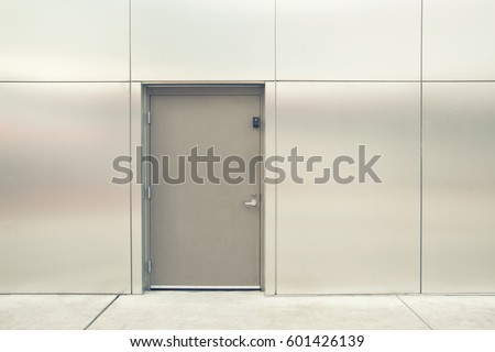 close grey door with aluminium or steel wall vintage filter