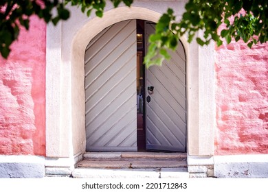 Close Up Of Grey Doors Of A Pink Church In Östergötland, Sweden