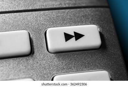 Close Up Of A Grey Fast Forward Button On Chrome Remote Control For A Hifi Stereo Audio System