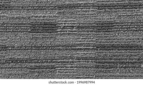 Close Up Of Grey Monochrome Carpet Texture Background For Interior Flooring Material. Office Carpet Background. Interior Floor Covering Material Background. 