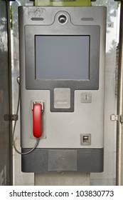 Close up of A grey panel box with a red phone attached