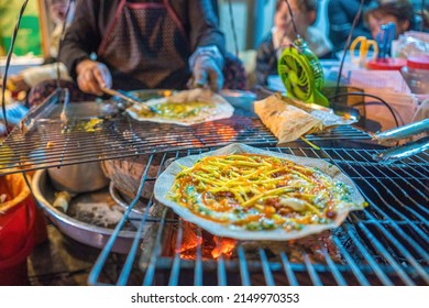 Close up Grilled girdle cake (Banh Trang Nuong) , a famous Vietnamese street stall eatery, a popular Vietnamese food in Da lat at night