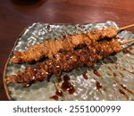 Close up grilled pork intestine skewers