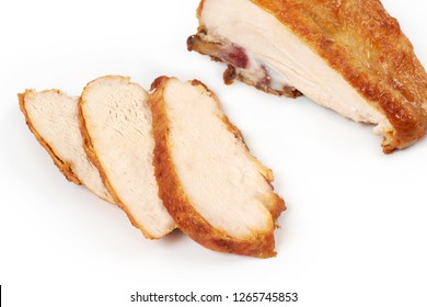 A Close Up Of Grilled, Sliced Chicken Breast Isolated On White Background .